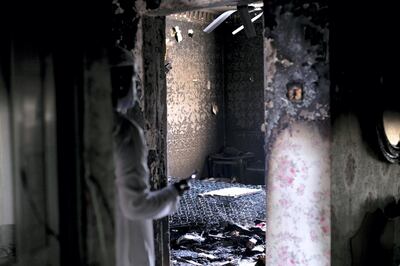 DUBAI, UNITED ARAB EMIRATES - JUNE 24 2019.

Aftermath of the fire at Al Saaedi's house. 

The family said the blaze broke out on the top floor of a two-storey property belonging to the pair's grandparents at about 10.30am on Monday.

The siblings - Hor Al-Saeedi, the youngest, and her brother Fahad - were alone in their bedroom on the first floor when the fire took hold.

Their aunt and her son rushed upstairs in an effort to save them but were unable to open the bedroom door. Both children could be heard inside calling for help.

“I can’t believe that my small children are dead, they shouldn’t have been left alone in the room,” Mr Al Saeedi told The National.


Photo by Reem Mohammed/The National)

Reporter: 
Section: NA