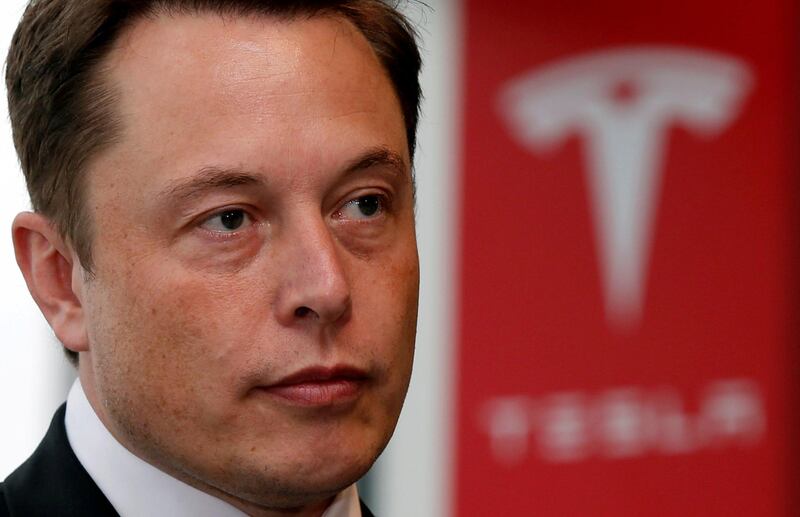 FILE PHOTO:  Tesla Motors Inc Chief Executive Elon Musk pauses during a news conference in Tokyo September 8, 2014.    REUTERS/Toru Hanai/File Photo