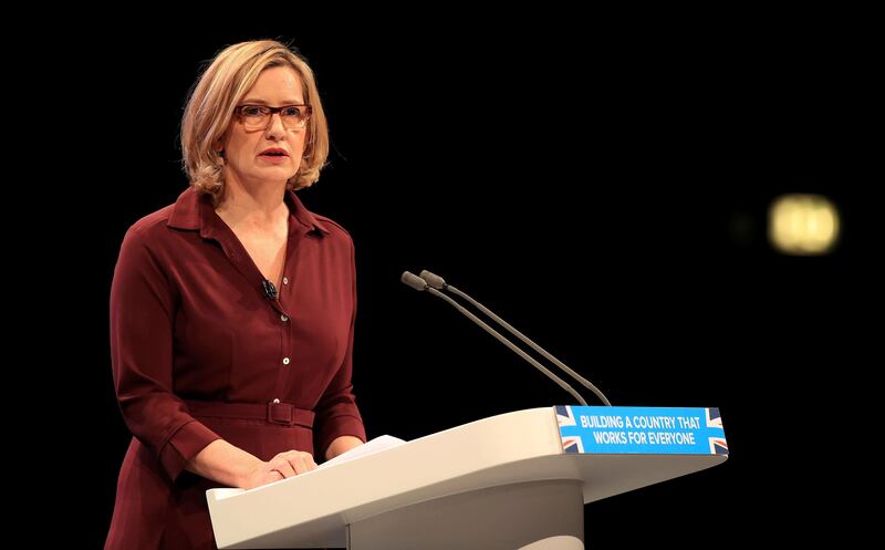 Britain's Home Secretary, Amber Rudd, speaks at the Conservative party conference at the Manchester Central Convention Complex in Manchester, England, Tuesday Oct. 3, 2017. The British government says it will make streaming extremist content an offense punishable by up to 15 years in prison. Currently it's illegal to download or store material that encourages violent attacks. But Home Secretary Amber Rudd says the law should be toughened to include "people who repeatedly view terrorist content online." (Peter Byrne/PA via AP)