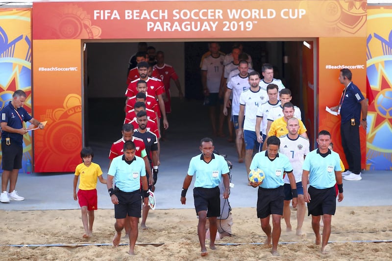 ASUNCION, PARAGUAY - NOVEMBER 24: Teams of Russia and United Arab Emirates enter the pitch before the FIFA Beach Soccer World Cup Paraguay 2019 group C match between Russia and United Arab Emirates at Estadio Mundialista "Los Pynandi" on November 24, 2019 in Asuncion, Paraguay. (Photo by Hector Vivas - FIFA/FIFA via Getty Images)