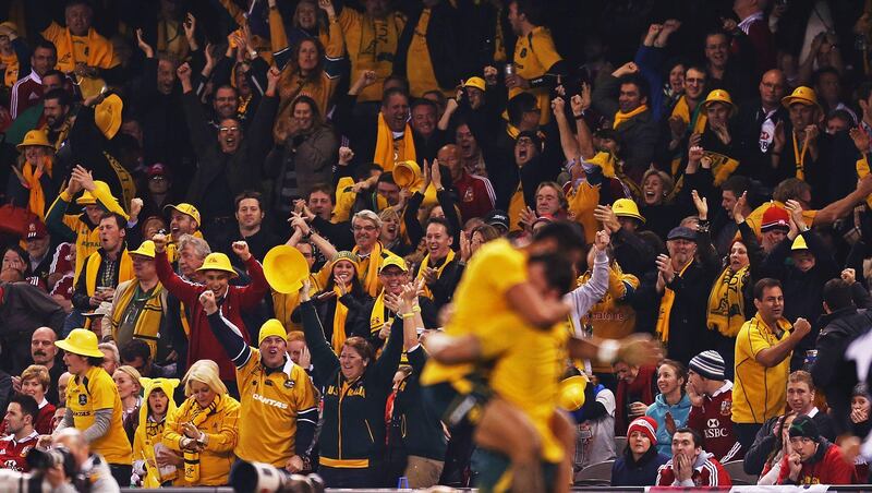 MELBOURNE, AUSTRALIA - JUNE 29:  Wallabies supporters celebrate in the crowd as Adam Ashley-Cooper of the Wallabies celebrates with team mate Christian Lealiifano of the Wallabies after scoring a try during game two of the International Test Series between the Australian Wallabies and the British & Irish Lions at Etihad Stadium on June 29, 2013 in Melbourne, Australia.  (Photo by Scott Barbour/Getty Images) *** Local Caption ***  171865575.jpg