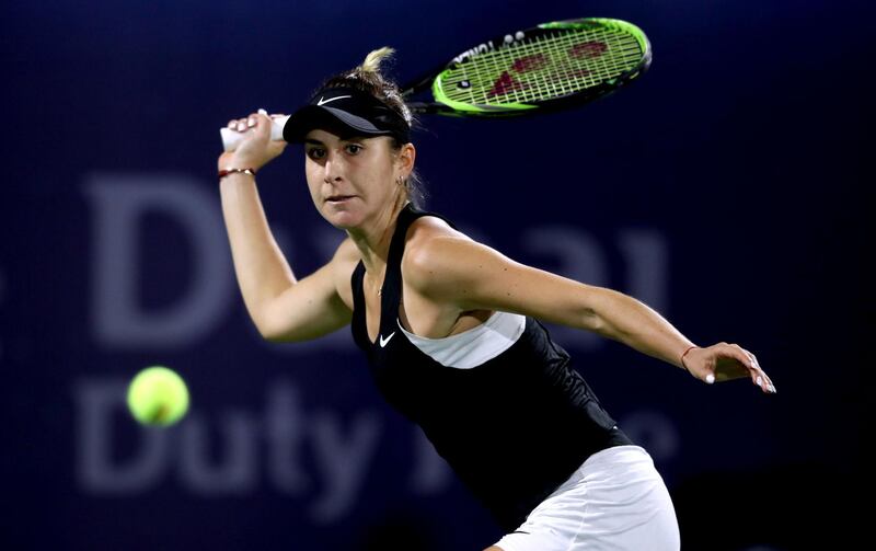 DUBAI, UNITED ARAB EMIRATES - FEBRUARY 21:  Belinda Bencic of Switzerland  plays a forehand against Simona Halep of Romania during day five of the Dubai Duty Free Tennis Championships at Dubai Tennis Stadium on February 21, 2019 in Dubai, United Arab Emirates. (Photo by Francois Nel/Getty Images)