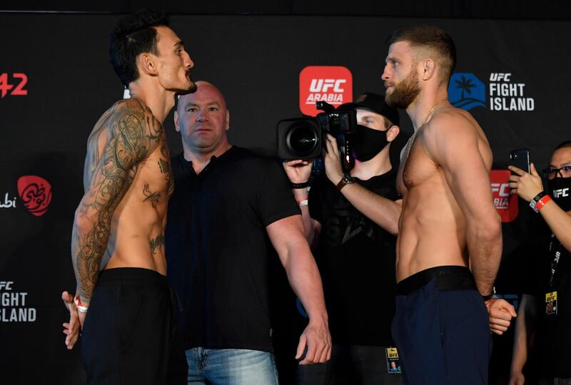 ABU DHABI, UNITED ARAB EMIRATES - JANUARY 15: (L-R) Opponents Max Holloway and Calvin Kattar face off during the UFC weigh-in at Etihad Arena on UFC Fight Island on January 15, 2021 in Abu Dhabi, United Arab Emirates. (Photo by Jeff Bottari/Zuffa LLC)