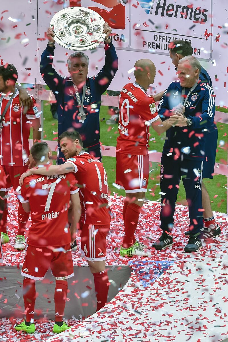 Bayern Munich coach Carlo Ancelotti lifts the Bundesliga trophy on May 20, 2017. AFP