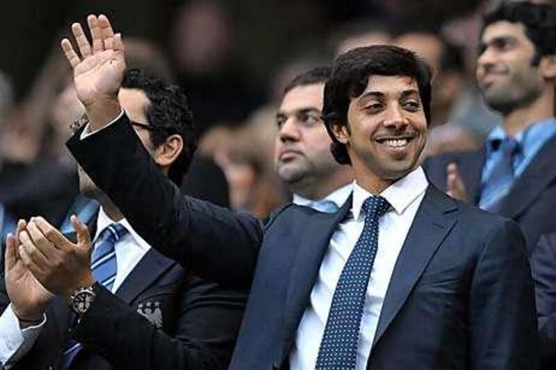 Sheikh Mansour raised his hand to acknowledge the applause on his arrival.