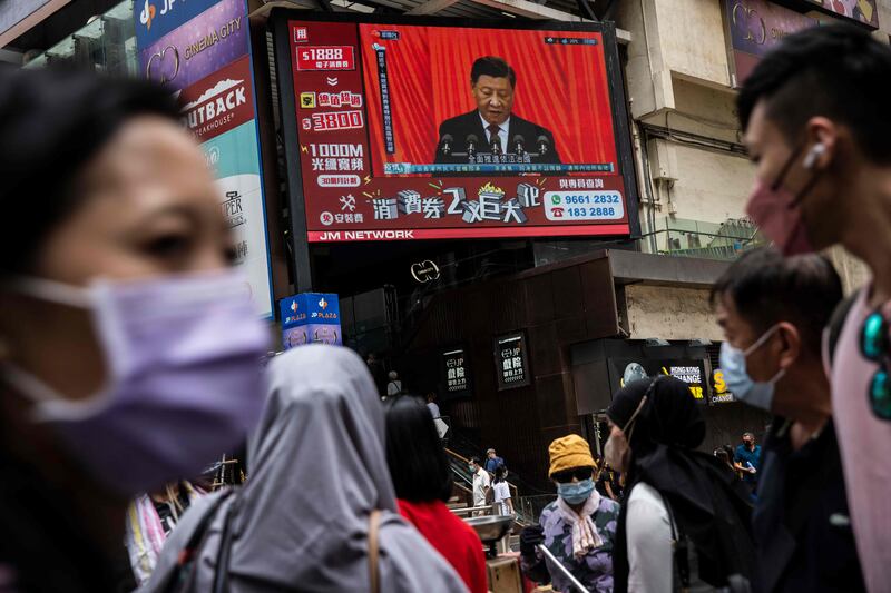 Mr Xi is shown on a TV on a street in Hong Kong. AFP