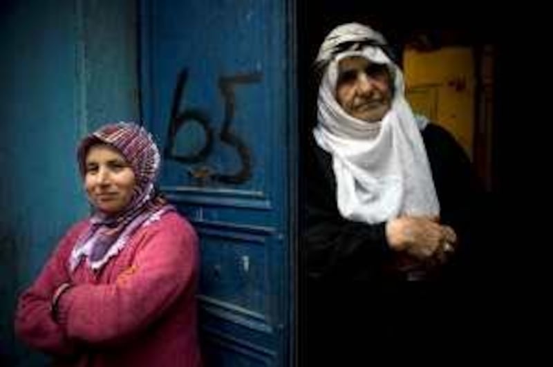 Istanbul, Turkey - April 6, 2009 - Rehyan Yetisir, 72, a Kurdish woman, from Yan Baskale in Southeast Turkey (right) and Asya Yetisir, 36, in front of their home. (Nicole Hill / The National) *** Local Caption ***  NH Kurd05.jpg