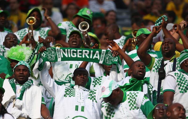 Nigeria fans cheer on the Super Eagles in Curitiba, Brazil. Julian Finney / Getty Images
