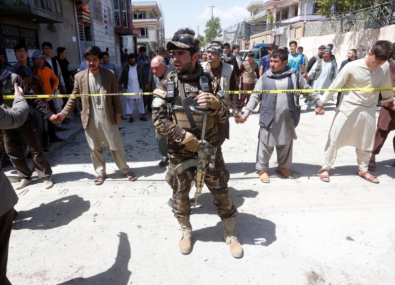 An Afghan security forces member stands guard at the site of a suicide bomb attack in Kabul, Afghanistan on April 22, 2018. Omar Sobhani / Reuters