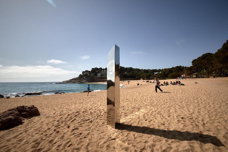 A metallic monolith surfaced on Sa Conca beach near the city of Girona in Spain's north-east Catalonia region. The two-metre sculpture is similar to the one that was found in Utah desert last November. EPA