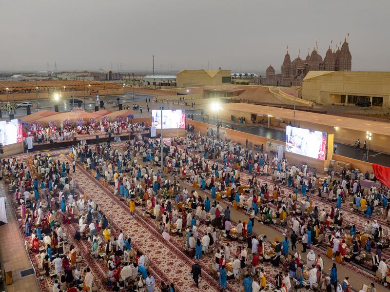 With the Abu Dhabi temple in the background, more than 900 devotees participate in a yagna ceremony to pray for peace and harmony. Baps Hindu Mandir Abu Dhabi