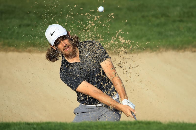 Tommy Fleetwood plays his second shot from a bunker on the 15th hole. Getty Images