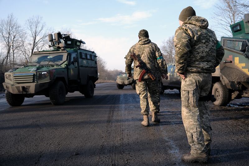 Soldiers prepare to head back to the front outside the heavily damaged city of Bakhmut, Ukraine, on Thursday. Getty