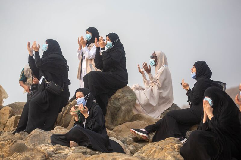 A handout picture provided by Saudi Ministry of Media on July 30, 2020 shows Mulism pilgrims praying on Mount Arafat, also known as Jabal al-Rahma (Mount of Mercy), southeast of the holy city of Mecca, during the climax of the Hajj pilgrimage amid the COVID-19 pandemic. Muslim pilgrims converged today on Saudi Arabia's Mount Arafat for the climax of this year's hajj, the smallest in modern times and a sharp contrast to the massive crowds of previous years. - === RESTRICTED TO EDITORIAL USE - MANDATORY CREDIT "AFP PHOTO / HO / SAUDI MINISTRY OF MEDIA" - NO MARKETING NO ADVERTISING CAMPAIGNS - DISTRIBUTED AS A SERVICE TO CLIENTS ===
 / AFP / Saudi Ministry of Media / - / === RESTRICTED TO EDITORIAL USE - MANDATORY CREDIT "AFP PHOTO / HO / SAUDI MINISTRY OF MEDIA" - NO MARKETING NO ADVERTISING CAMPAIGNS - DISTRIBUTED AS A SERVICE TO CLIENTS ===
