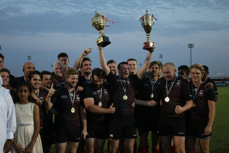 Dubai Exiles celebrate their UAE Premiership title win after victory against Al Ain Amblers. Navin Khianey for The National