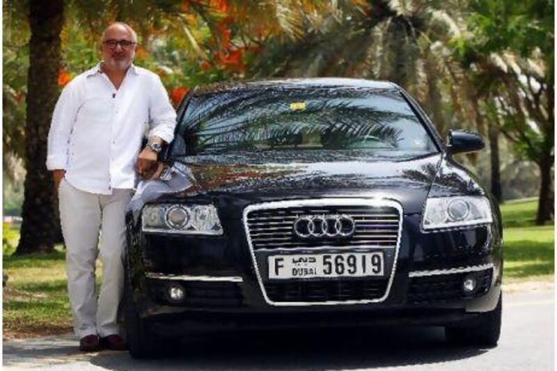 Youssef El Deeb, outside his office in Dubai, treasures his Audi A6, which he decided on after test driving both it and its larger counterpart, the A8. Satish Kumar for The National