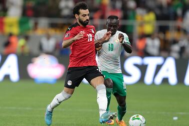 Mohamed Salah (L) of Egypt vies for the ball with Sadio Mane (R) of Senegal during the FIFA Qatar 2022 World Cup Africa qualifying match between Egypt and Senegal at the Diamniadio Olympic Stadium in Dakar, Senegal, 29 March 2022.   EPA / ALIOU MBAYE