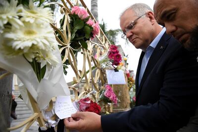 epa07441241 Australian Prime Minister Scott Morrison (2-R) looks at floral tributes to the victims of the Christchurch terror attack during a visit to the Lakemba Mosque, at Lakemba in south west Sydney, Australia, 16 March 2019. The Prime Minster met with Islamic community leaders following the terror attack in Christchurch, New Zealand. At least 49 people were killed by a gunman, believed to be Brenton Harrison Tarrant, and 20 more injured and in critical condition during the terrorist attacks against two mosques in New Zealand during Friday prayers on 15 March.  EPA/DAN HIMBRECHTS  AUSTRALIA AND NEW ZEALAND OUT