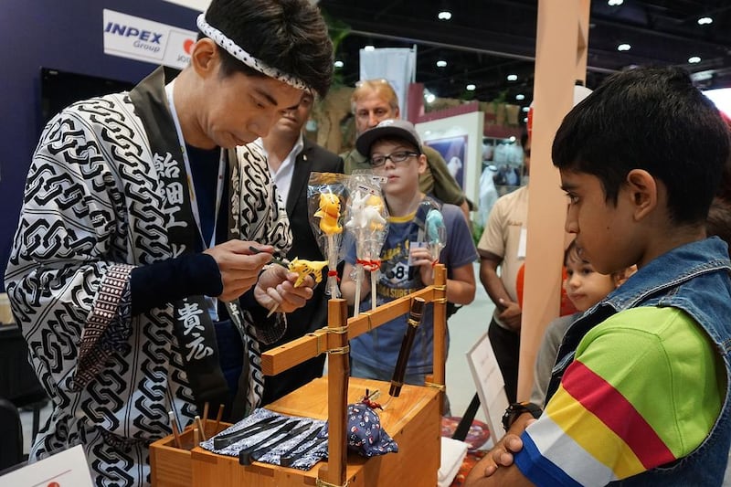 Takahiro Mizuki fascinates onlookers with his handmade candy animal sculptures at Adihex. Delores Johnson / The National 