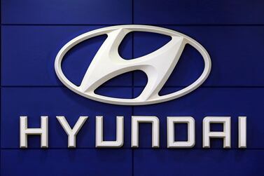 A Hyundai Motor logo at a showroom in Seoul. The South Korean company's shares jumped on reports that it is set to sign a partnership with Apple to produce autonomous electric cars. AP Photo