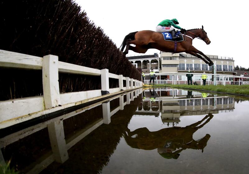 Adjali, ridden by Daryl Jacob, clears a fence during the James Henman Memorial Novices' Limited Handicap Chase at Ludlow Racecourse in England on Thursday, March 4. PA