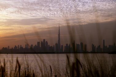 DUBAI, UNITED ARAB EMIRATES - NOVEMBER 29: The Burj Khalifa, (C) stands surrounded by other skyscrapers on November 29, 2020 in Dubai, United Arab Emirates. The country's government recently decreed that foreigners can fully own local firms, a change from previous law that required foreign investors to have an Emirati partner with at least a 51% stake in the company. Several types of businesses were excluded from the new law, such as those in the energy, telecommunications and transport sectors. (Photo by Francois Nel/Getty Images)