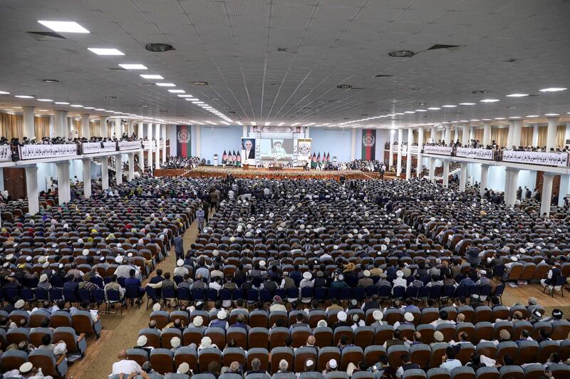 In this handout photograph taken on August 7, 2020 and released by the Press Office of President of Afghanistan, people attend the first day of the Loya Jirga, a grand assembly, at the Loya Jirga Hall in Kabul. Thousands of Afghans began a three-day gathering in Kabul on August 7 to decide whether to release about 400 Taliban prisoners, including many involved in attacks that killed scores of Afghans and foreigners. - RESTRICTED TO EDITORIAL USE - MANDATORY CREDIT "AFP PHOTO / PRESS OFFICE OF PRESIDENT OF AFGHANISTAN" - NO MARKETING - NO ADVERTISING CAMPAIGNS - DISTRIBUTED AS A SERVICE TO CLIENTS
 / AFP / Press Office of President of Afghanistan / - / RESTRICTED TO EDITORIAL USE - MANDATORY CREDIT "AFP PHOTO / PRESS OFFICE OF PRESIDENT OF AFGHANISTAN" - NO MARKETING - NO ADVERTISING CAMPAIGNS - DISTRIBUTED AS A SERVICE TO CLIENTS
