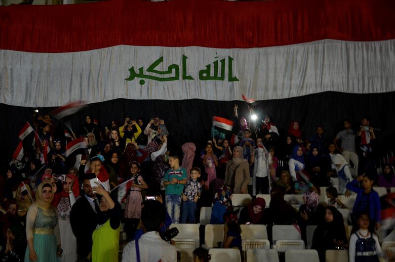 People celebrate Iraqi prime minister Haider Al Hadi's declaration of victory in Mosul on July 11, 2017. Further victory celebrations planned for Saturday have forced a Sunni conference on Iraqi post-war unityto be postponed. Reuters
