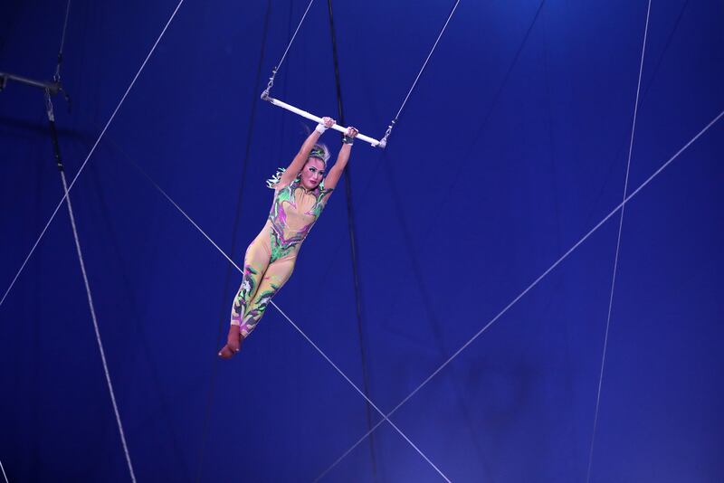The show features trapeze artists.