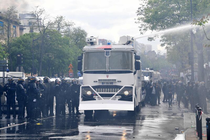Police use water cannons to disperse crowds as thousands of people took to the streets of the French capital. Jeff J Mitchell/Getty Images