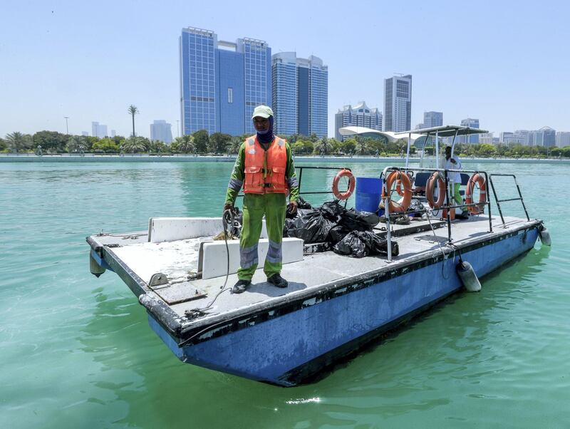 Abu Dhabi, United Arab Emirates, June 15, 2019.  
AUH clean up mission by volunteers at the Abu Dhabi Dhow Harbour. --  The trach barge docks at the harbour.
Victor Besa/The National
Section:  NA
Reporter:  Anna Zacharias