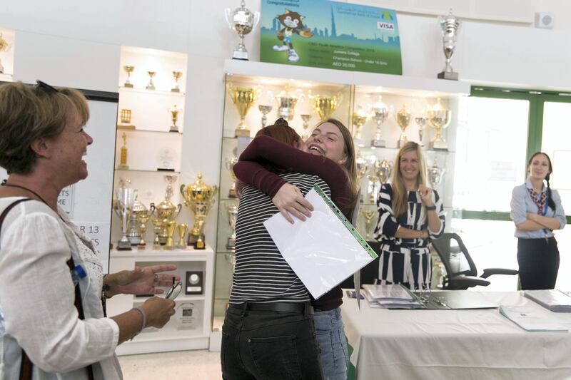 DUBAI, UNITED ARAB EMIRATES - AUG 17: 

Two students embrace upon hearing each other's A-level examination results at Jumeirah College School .


(Photo by Reem Mohammed/The National)

Reporter:  Caline Malek
Section: NA