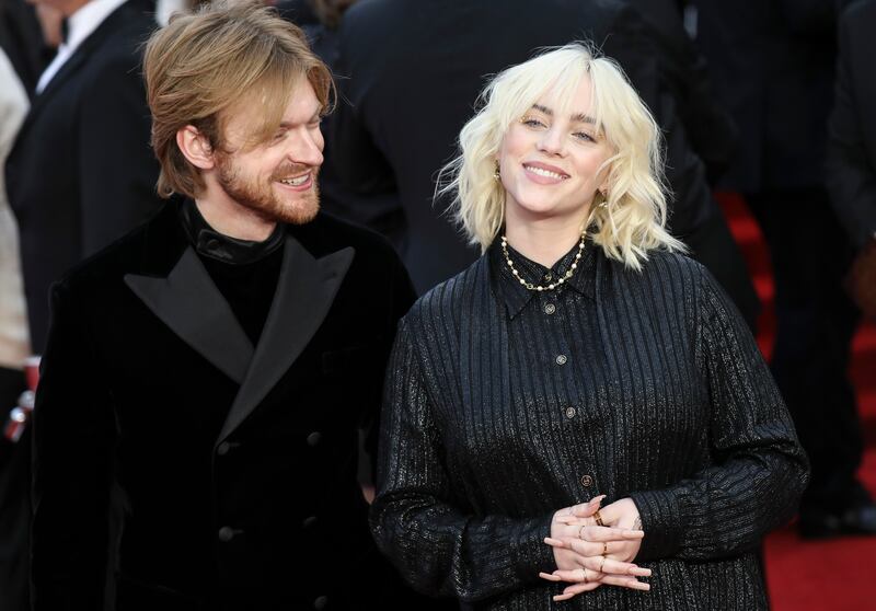 American singer-songwriters Finneas O'Connell, left, and Billie Eilish pose for photographers upon arrival for the world premiere. Photo: AP