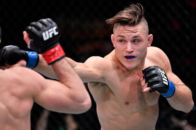 Drew Dober punches Islam Makhachev in their lightweight fight. USA TODAY Sports