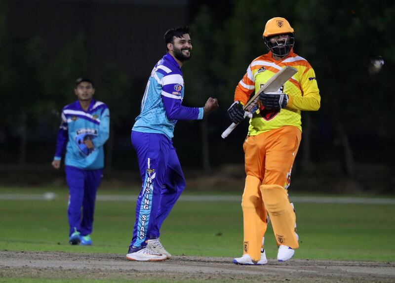 Ajman, United Arab Emirates - Reporter: Paul Radley. Sport. Cricket. Hawk's Umer Farooq takes the wicket of Lion's Abdullah Azhar. Hawks v Lions in the Karwan Rising Stars league. Ajman. Tuesday, January 19th, 2021. Chris Whiteoak / The National