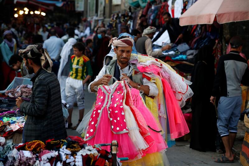 Yemenis walk through a market in the old quarter of Sanaa.  EPA
