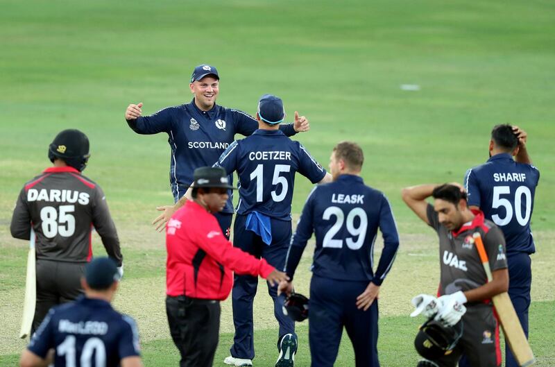 Dubai, United Arab Emirates - October 30, 2019: Scotland celebrate the win after the game between the UAE and Scotland in the World Cup Qualifier in the Dubai International Cricket Stadium. Wednesday the 30th of October 2019. Sports City, Dubai. Chris Whiteoak / The National