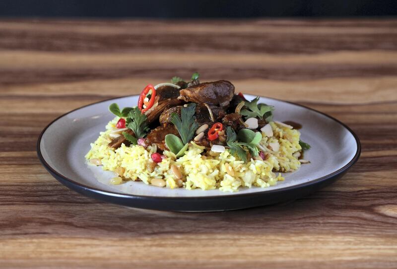 Dubai, United Arab Emirates - May 10, 2019: Iftar Signature Dish. Slow braised lamb shoulder in middle-eastern spices, scented rice pilaf, confit garlic and lemon yogurt from Ramadan Nights by Dish. Friday the 10th of May 2019. Al Quoz, Dubai. Chris Whiteoak / The National

Chefs description: This is the main dish of the meal at Ramadan nights, IÕve create all the other dishes around this one. The inspiration for the dish is using traditional regional ingredients and techniques and putting my Australian spin on it. The lamb is marinated for two days and then braised for 6 hours to give it the depth of flavour IÕm after.