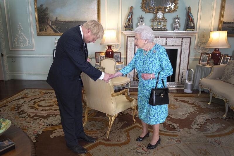 Queen Elizabeth II welcomes newly elected leader of the Conservative party Boris Johnson at Buckingham Palace, London, where she invited him to become UK prime minister and form a new government in July 2019. PA