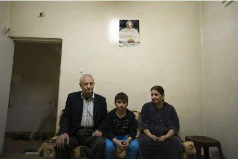 Neysan Jibro Hermes with his grandson, Omeid, 14, and wife, Choni Musa, Iraqi Christians living as refugees in Syria.
Phili Sands / The National