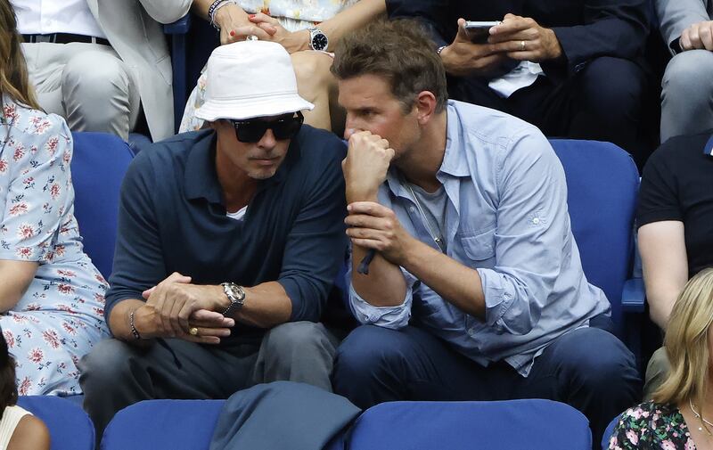 US actors Brad Pitt, left, and Bradley Cooper watch Daniil Medvedev of Russia play Novak Djokovic of Serbia in the men's US Open final at the USTA National Tennis Center in Flushing Meadows, New York. EPA