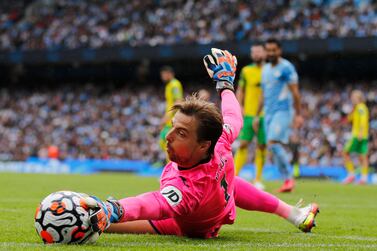 Norwich City's Dutch goalkeeper Tim Krul stops the ball going out of play during the English Premier League football match between Manchester City and Norwich City at the Etihad Stadium in Manchester, north west England, on August 21, 2021.  (Photo by Adrian DENNIS / AFP) / RESTRICTED TO EDITORIAL USE.  No use with unauthorized audio, video, data, fixture lists, club/league logos or 'live' services.  Online in-match use limited to 120 images.  An additional 40 images may be used in extra time.  No video emulation.  Social media in-match use limited to 120 images.  An additional 40 images may be used in extra time.  No use in betting publications, games or single club/league/player publications.   /  