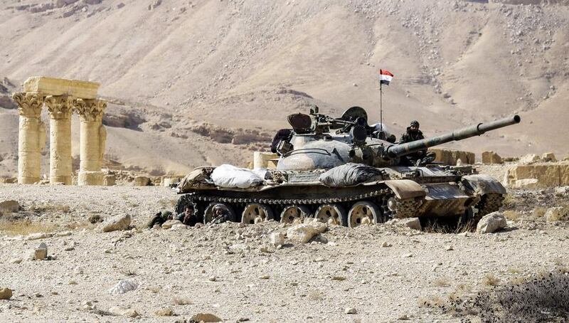 A Syrian army T-62 tank at the damaged site of the ancient city of Palmyra in central Syria. Louai Beshara / AFP

