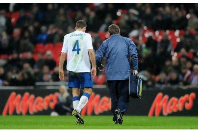 Steven Gerrard limps off the field after injuring his hamstring in a friendly match on Wednesday.