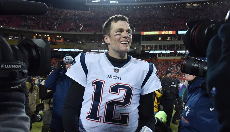 epa07304882 New England Patriots quarterback Tom Brady smiles on the field after beating the Kansas City Chiefs in overtime in the AFC Championship NFL American football game between the New England Patriots and the Kansas City Chiefs at Arrowhead Stadium in Kansas City, Missouri, USA, 20 January 2019.  EPA/ED ZURGA