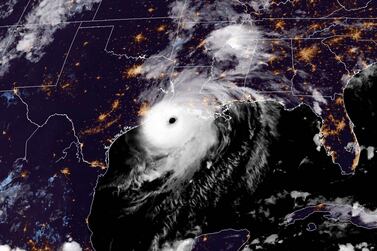 A satellite image shows Hurricane Laura reaching the coasts of Louisiana and Texas on August 26. AFP