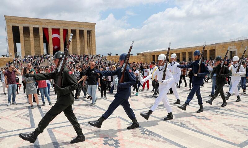 Ceremonial soldiers perform as people visit Anitkabir, Mustafa Kemal Ataturk’s mausoleum, to mark the 100th anniversary of May 19th Commemoration of Ataturk in Ankara.   AFP