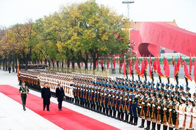 Presidents Xi and Macron view an honour guard in Beijing in 2019. Getty 