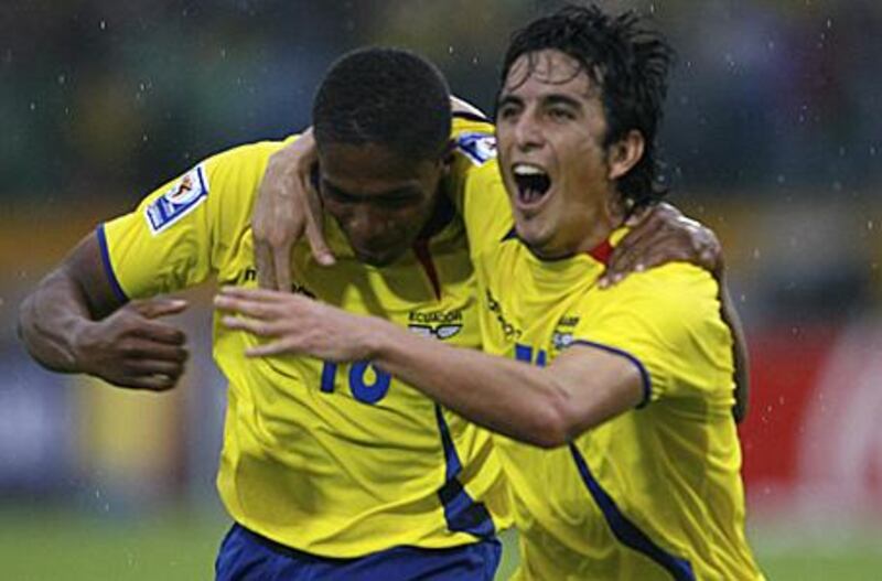 Antonio Valencia, left, celebrates with Ecuador teammate Pablo Palacios during their World Cup qualifying victory against Argentina. The winger has been signed by Manchester United from Wigan Athletic.
