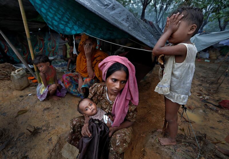 Rohingya refugees wait in a camp in Cox's Bazar, Bangladesh. Cathal McNaughton / Reuters